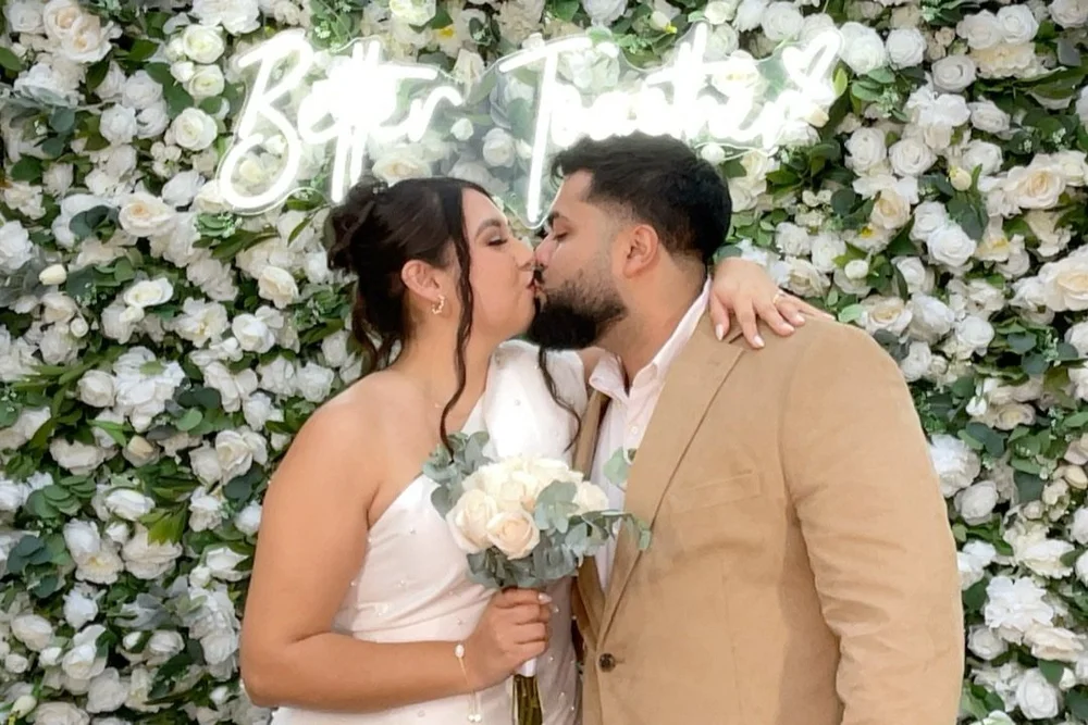 Wedding photo booth with neon sign